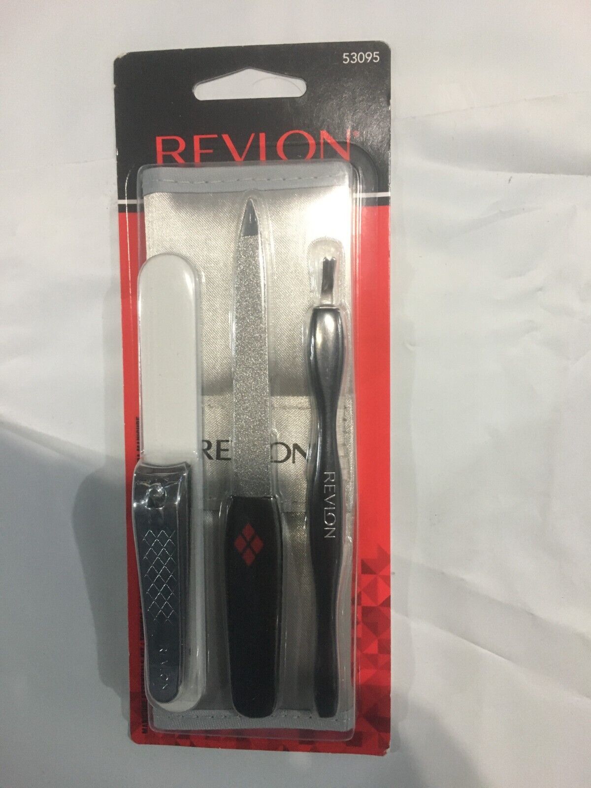 Revlon Manicure To Go 4-Piece Kit with Travel Pouch Includes Curved Blade Nail Clipper  Compact Emery File and Dual-ended Cuticle Trimmer